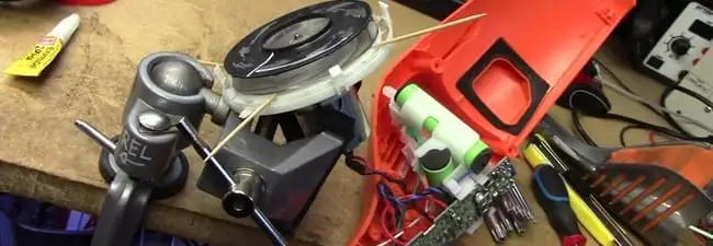 Vacuum cleaner repair parts and tools on a workbench in Wichita, KS