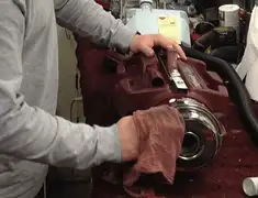 Vacuum repair technician cleaning and servicing a vacuum motor in Wichita, KS
